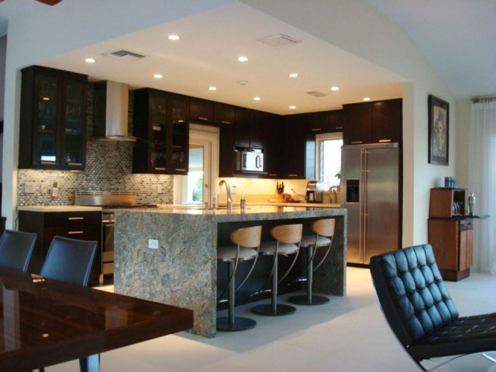 Kitchen with Marble Island and Black Cabinets