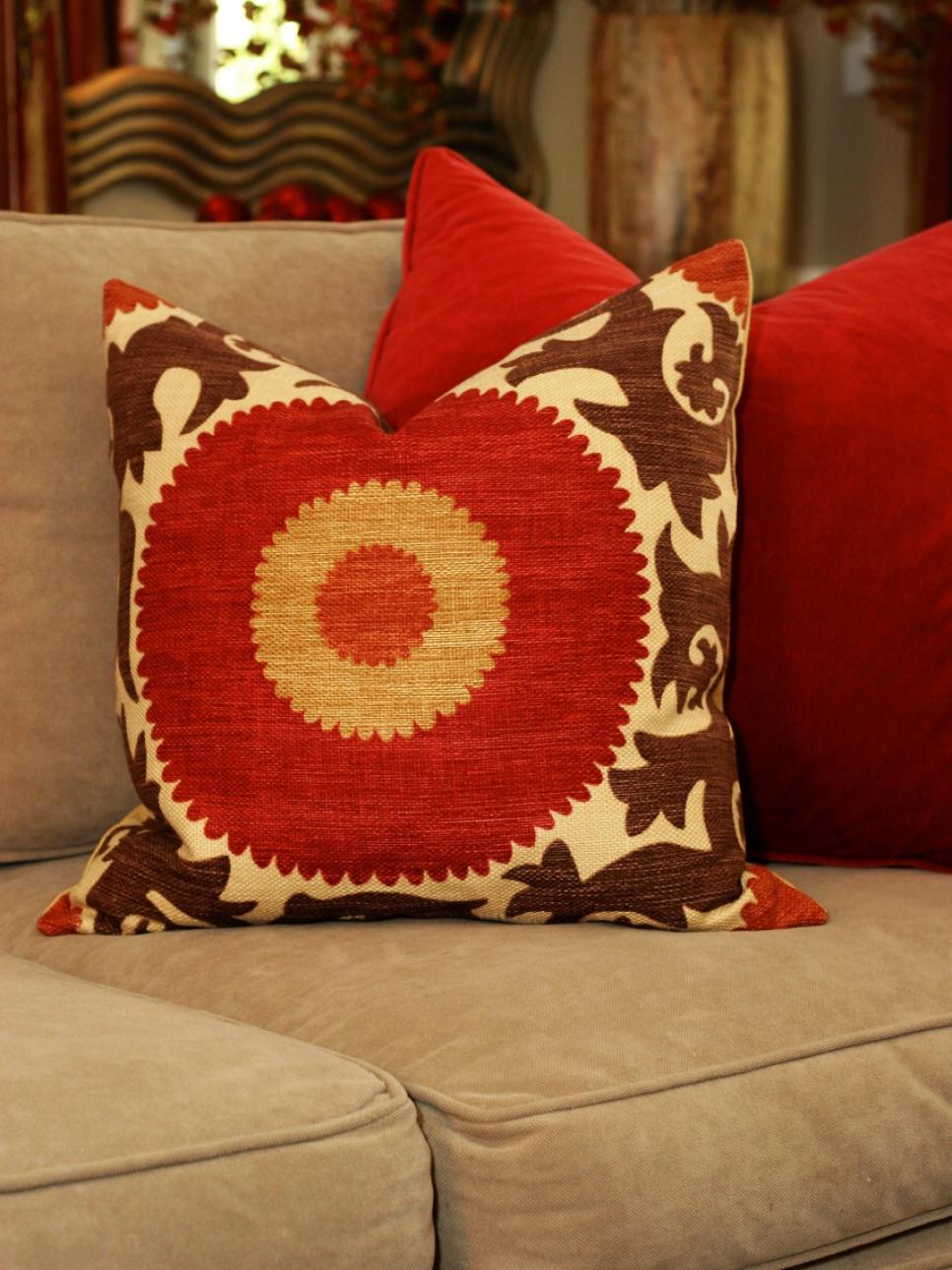 Red-Orange Sunshine Throw Pillow on Beige Living Room Sofa
