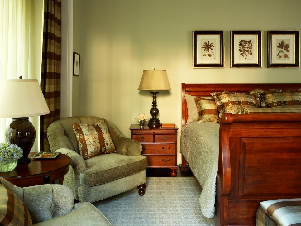 Neutral Bedroom With Plush Chairs and Wood Sleigh Bed