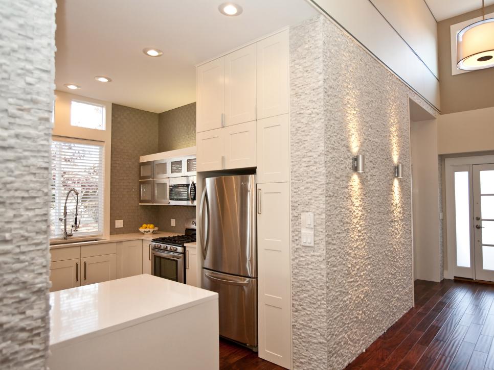 Open Kitchen With White Cabinets & Textured Walls