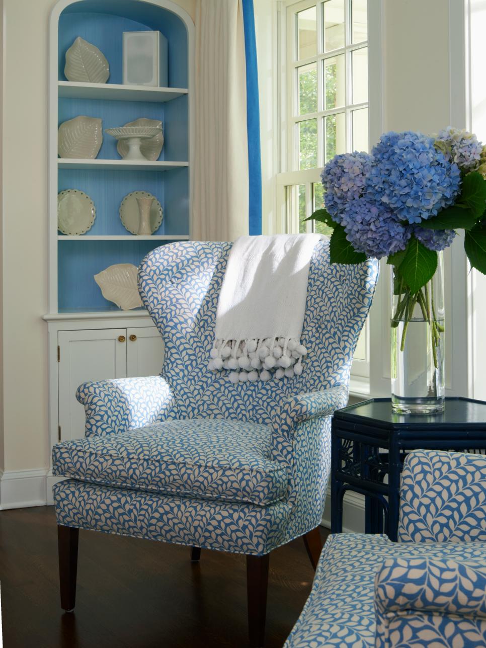 Blue and White Wingback Chair with Patterned Upholstery 