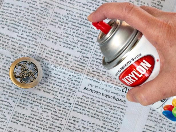 Woman Spray Painting knobs