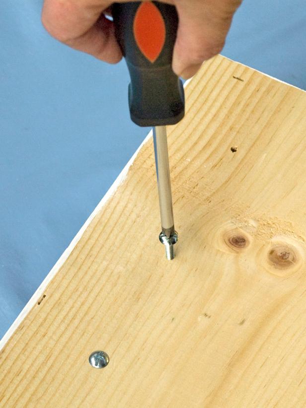 Feed the knob bolts in from the back (Image 2) and screw the knobs on from the front (Image 3).
