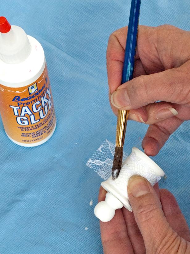 Cut a piece of lace to fit around the spool and decoupage it on, painting craft glue all the way around (Images 2-3).