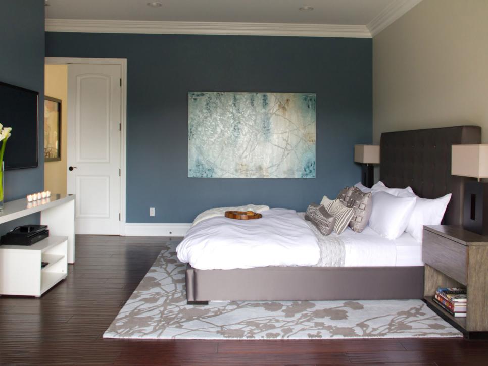 Blue Contemporary Bedroom With Blue Artwork and White Bedding