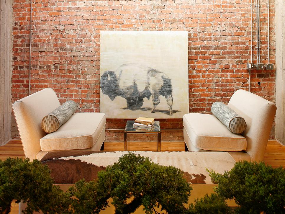 Neutral Seating Area With Brick Wall and Art