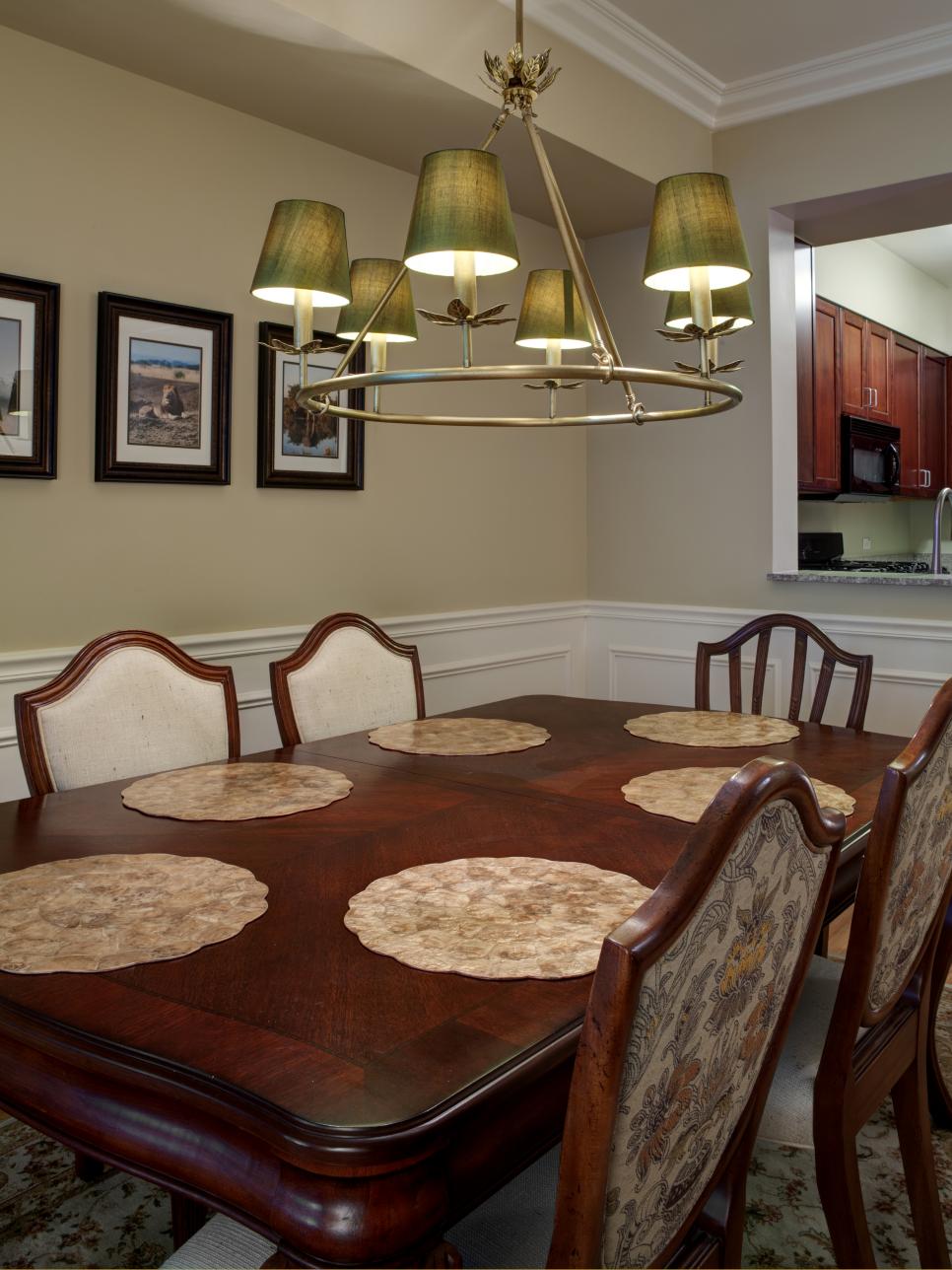 Neutral Dining Room With Wainscoting and Metal Chandelier 
