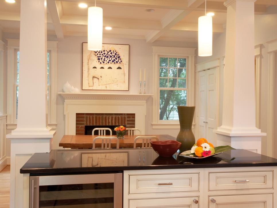 White Kitchen With Black Countertops and Wine Cooler