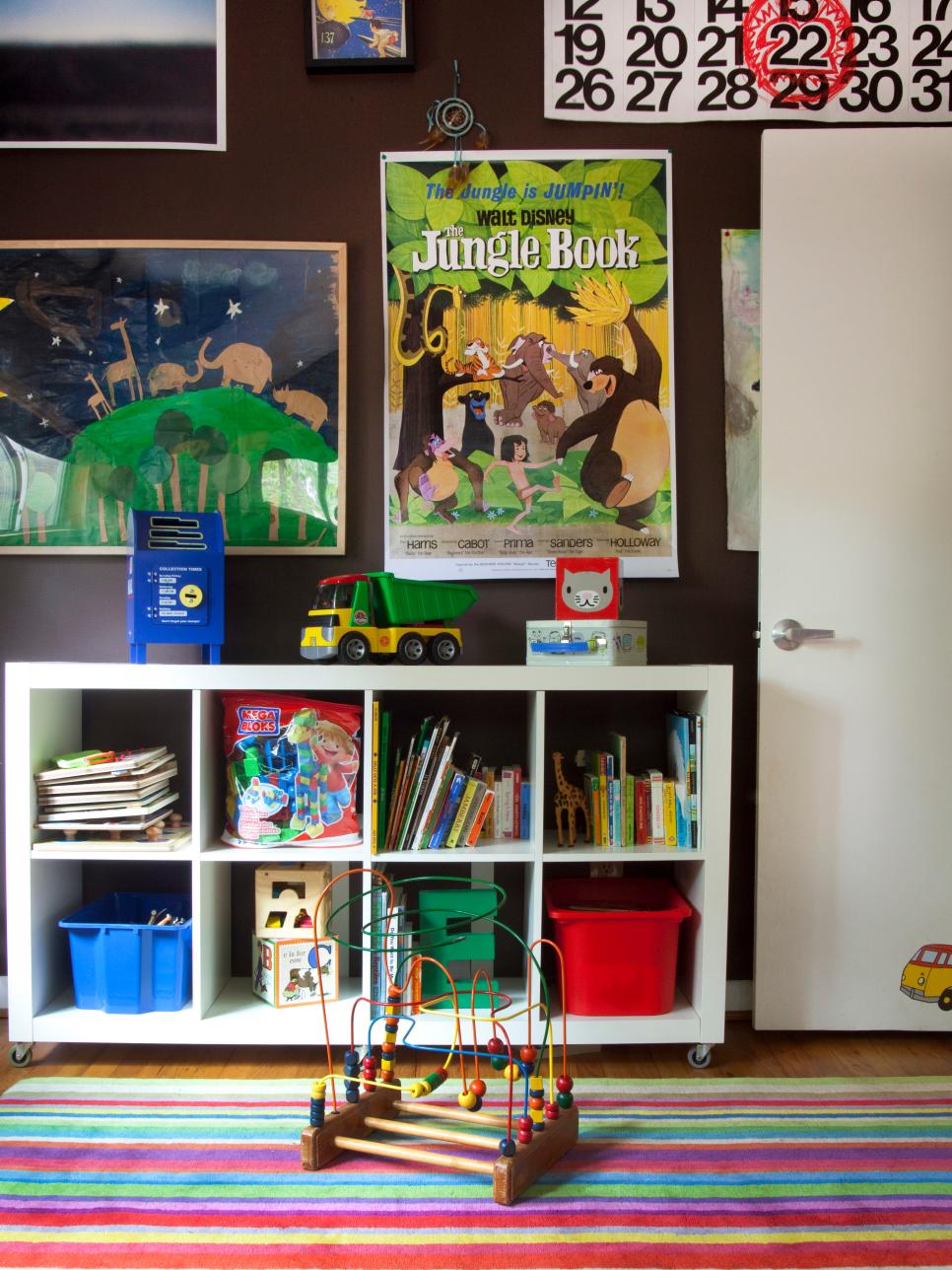 Kids' Bedroom With Mobile Bookcase and Eclectic Artwork