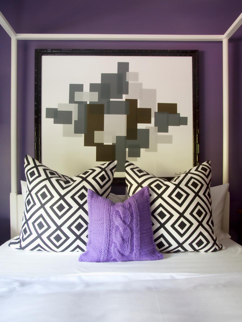 Purple Bedroom With Black & White Graphic Pillows and Artwork