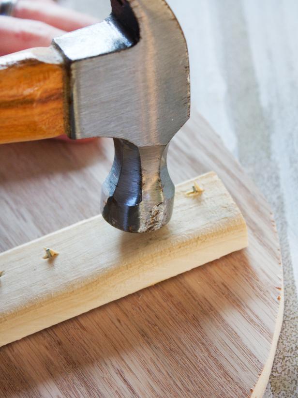 Flip the rat over again, and hammer down the ends of any nails that are sticking through the back.