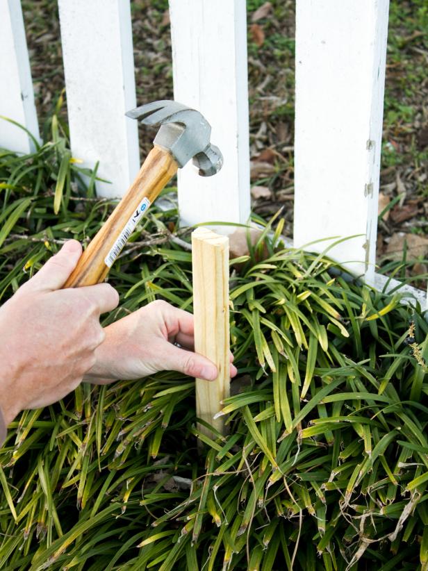 Hammering stake into ground
