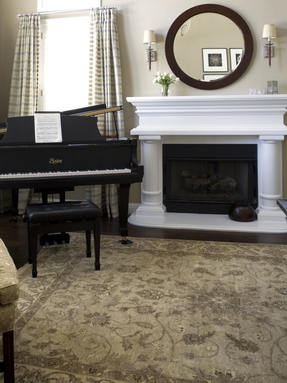 Neutral traditional living room with fireplace and piano