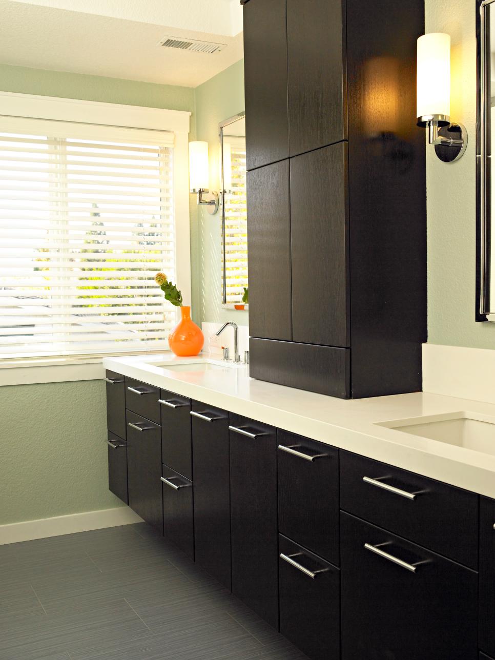 Modern Green Bathroom With White Countertop and Black Cabinets