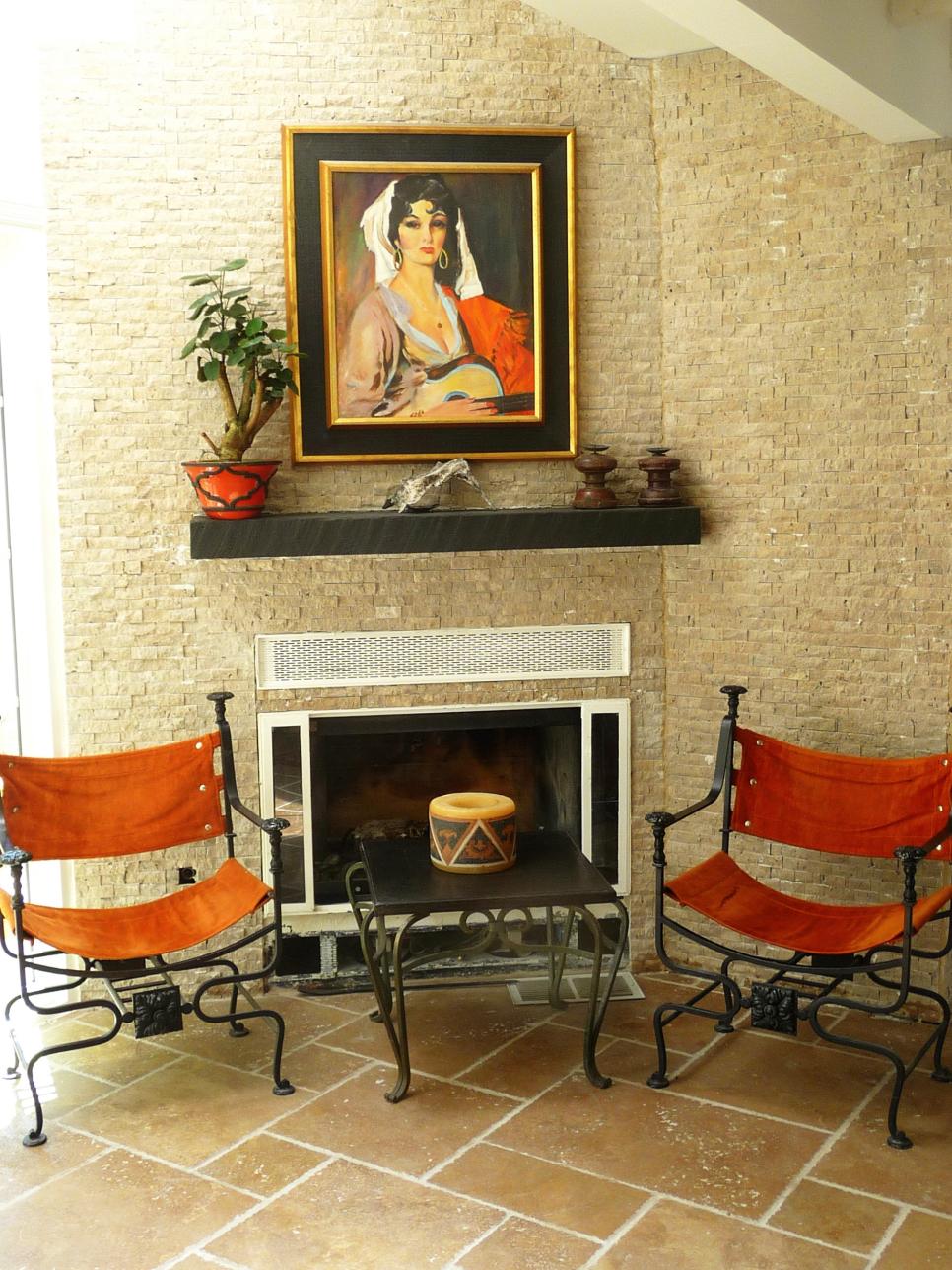 Orange Canvas Chairs in Front of Neutral Brick Wall and Fireplace