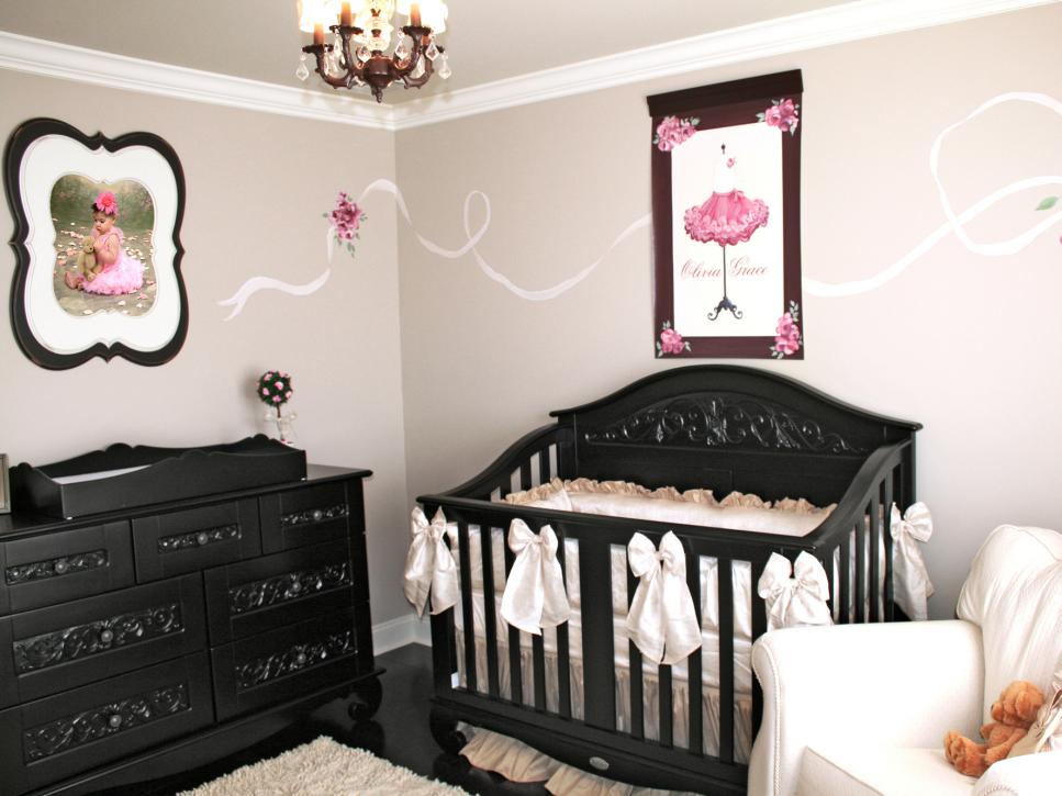 Pink and Black Nursery With Framed Art and Photograph