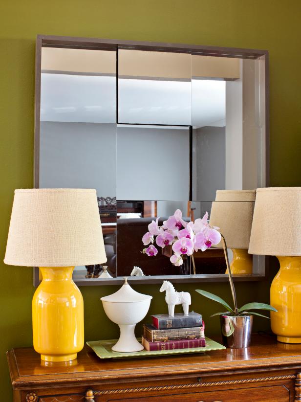 Modern Green Entryway With Side Table, Mirror and Yellow Lamps