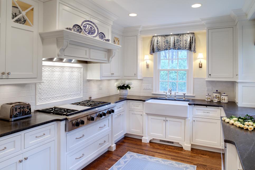 White Kitchen with Black Countertops and Farmhouse Sink