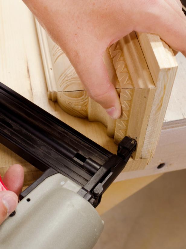 Fill holes with wood filler and sand smooth. Tip: Your finger is a great tool for applying wood filler to curved surfaces.