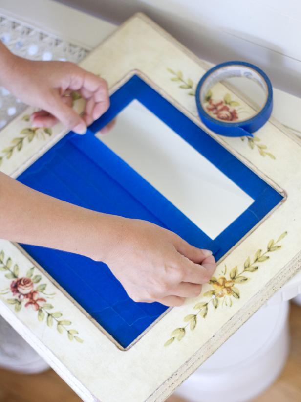 Use painter's tape to completely mask off the mirror.