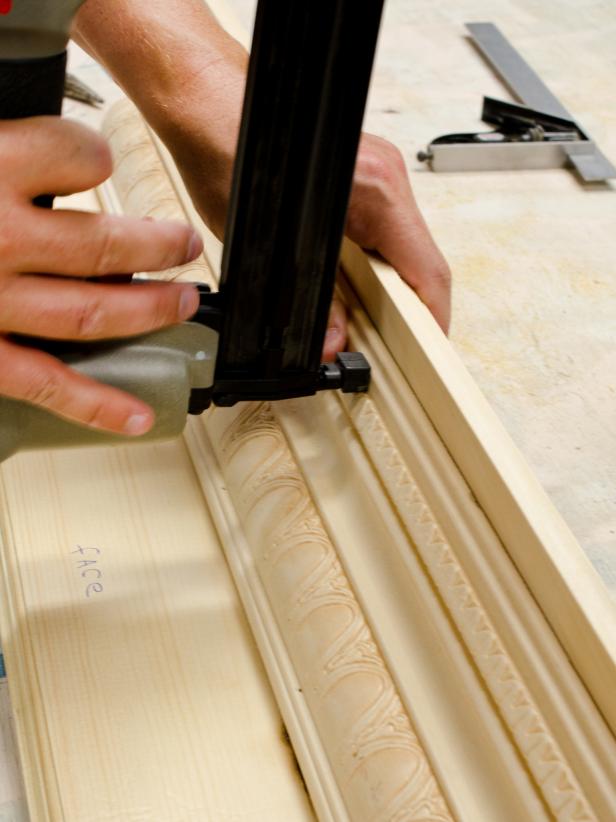 Secure molding to bottom of shelf with brads, then nail in return pieces.