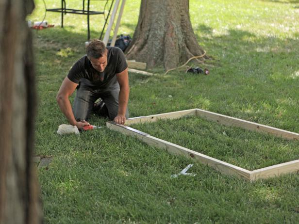Lay the five total pieces out on a flat, level surface. Next, line pieces up using a speed square with the two 37-inch pieces on the top and bottom and the 72 inch pieces on the sides. Fasten two top corners together to ensure frame pieces have been properly cut to size.