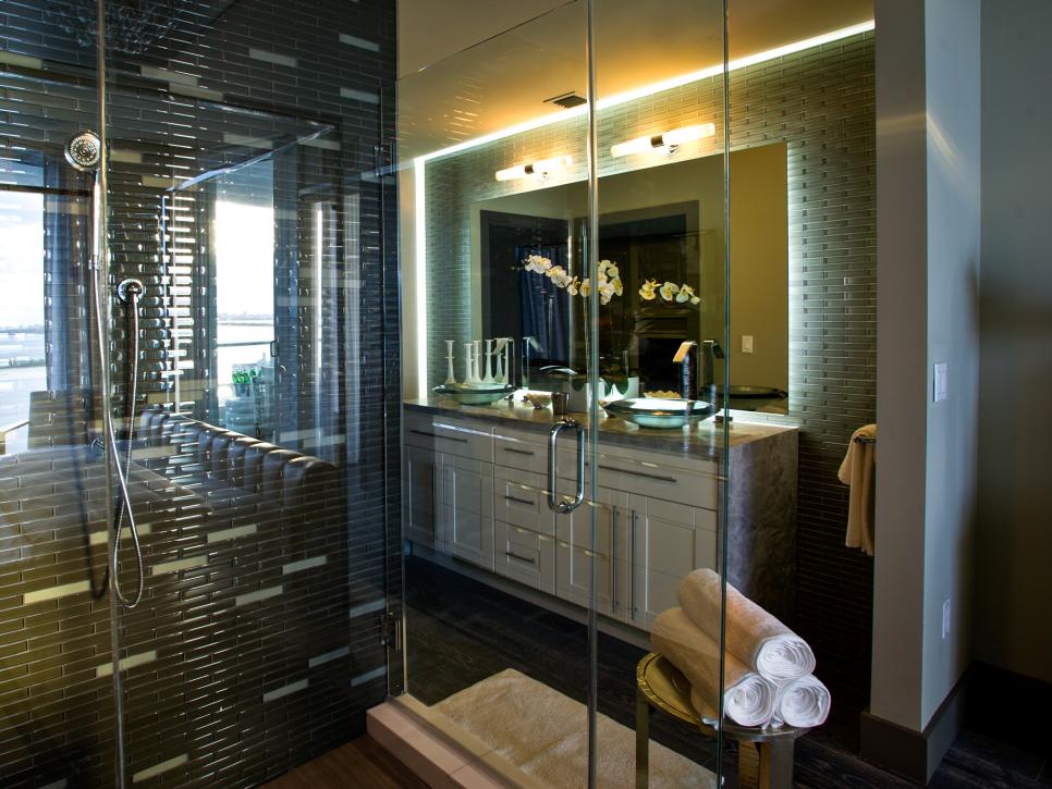 Bathroom With Glass Shower, Black and Gray Tile and Double Vanity