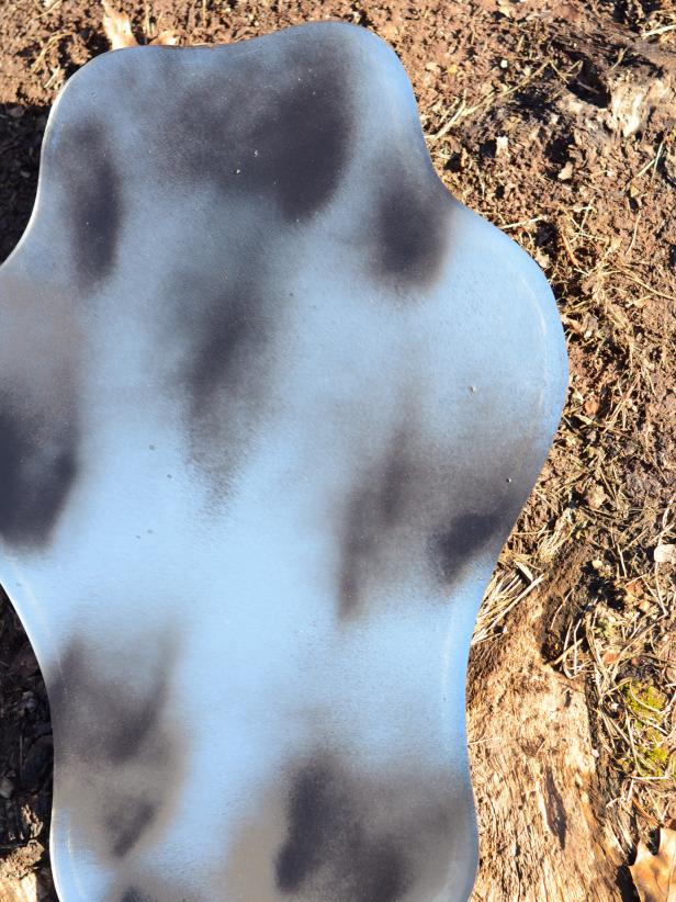 Use black spray paint and acetone to create a spooky, smoky look on an old mirror.