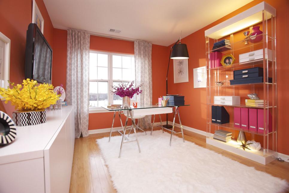 Orange Office With Transparent Bookshelf, Glass Desk & White Cabinets