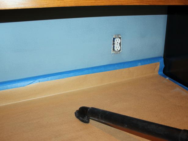 After sanding areas where tile will be applied, clean up any residual dust with a vacuum cleaner or tack cloth.