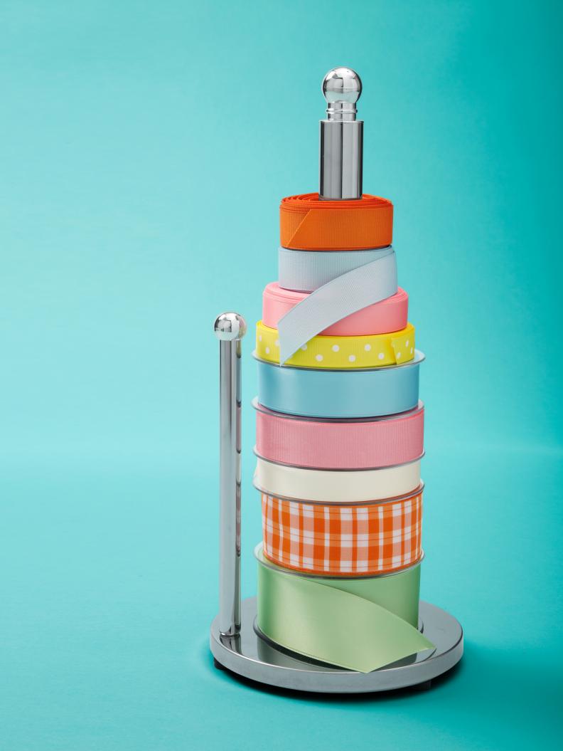 Silver Paper Towel Holder Holding Colorful Ribbons