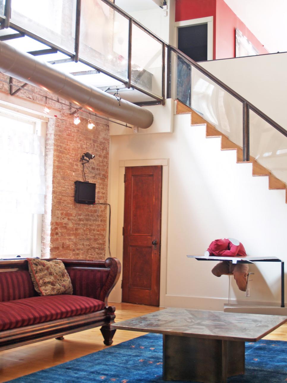 Loft Living Room with Exposed Brick and Victorian Soda
