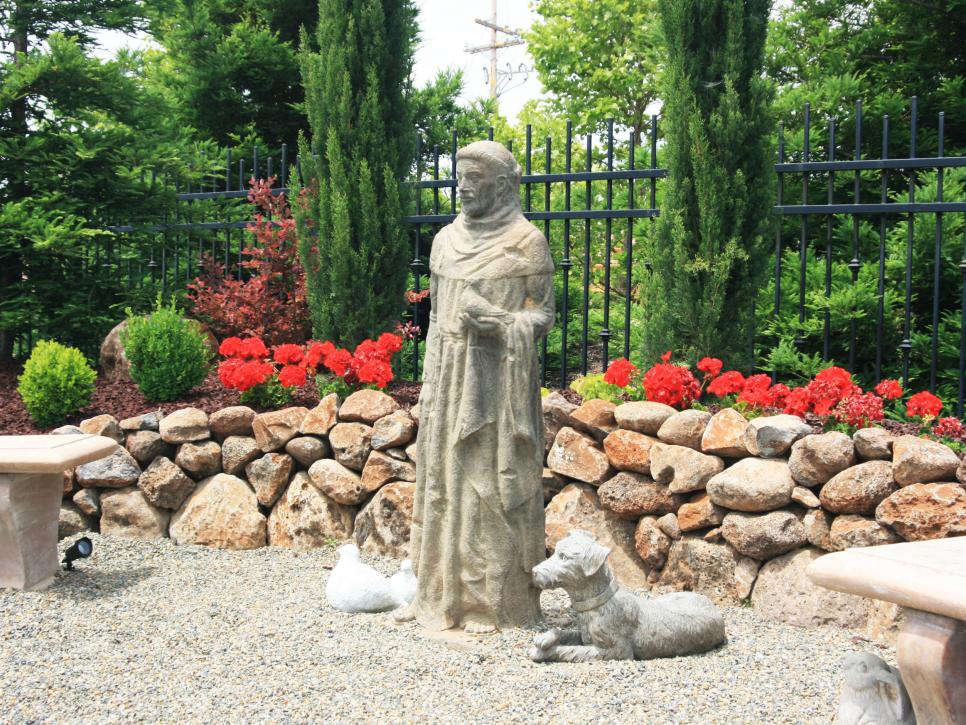 Garden Statue and Flowers in Outdoor Seating Area