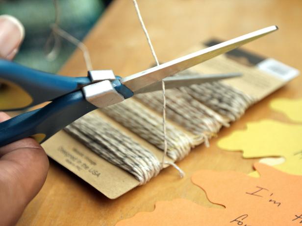Cut baker's twine into three-inch strips.