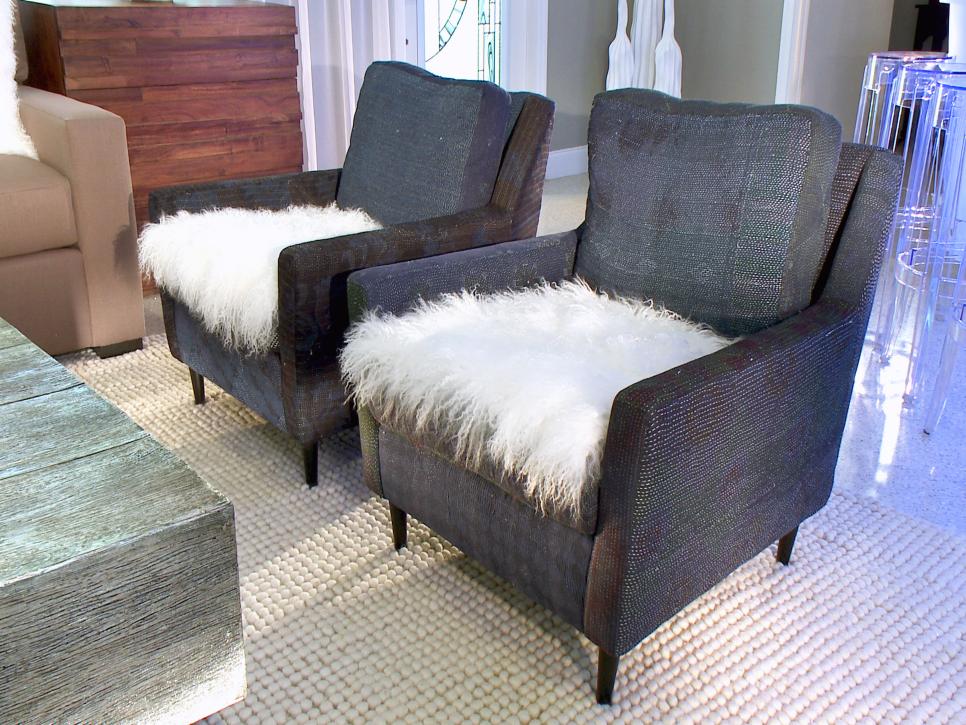 Gray Armchairs With White Faux Fur Seats Near Acrylic Barstools