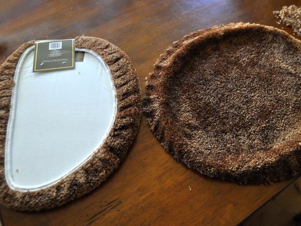 Start by cutting the elastic inner ring off the toilet seat covers. The little strings and pieces of fluff from the covers can be messy, so give yourself a few minutes to clean up.