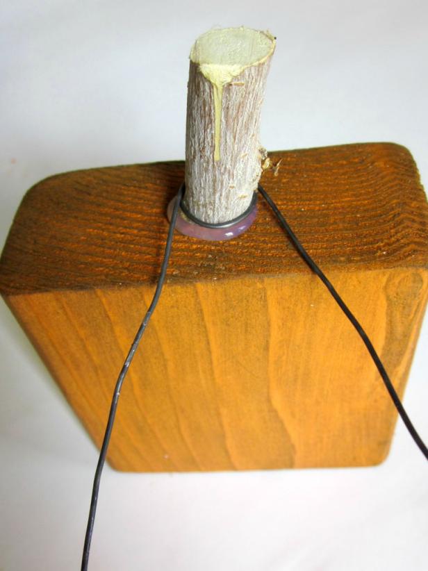 Cut a piece of wire, then curl the ends by bending them around a screwdriver or pencil.