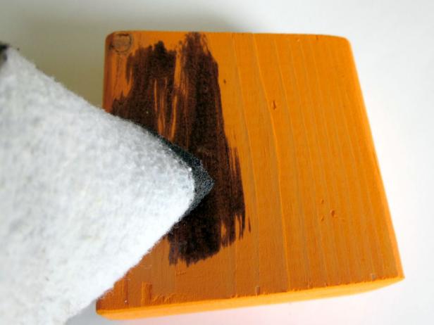 To mix up a brown wash add a squirt of dark brown paint to about 1/2 cup of water. Apply wash with a rag or sponge brush by brushing it on and then wiping the excess off with a dry rag or paper towel.