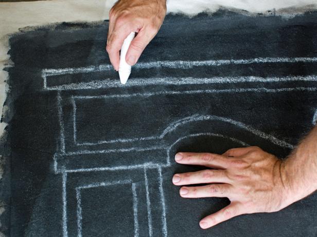 Use chalk to draw the silhouette of a mantel for faux mantel hanging.