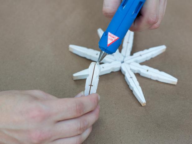 Finally, add a bead of hot glue to the angled tip of the hanging spoke.