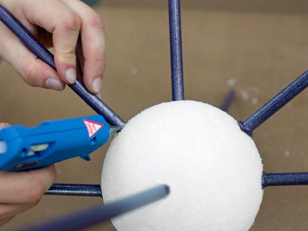 Once in place, add hot glue around the space between the foam sphere and the replaced dowel. Note: This extra layer of glue will add more stability to each dowel.