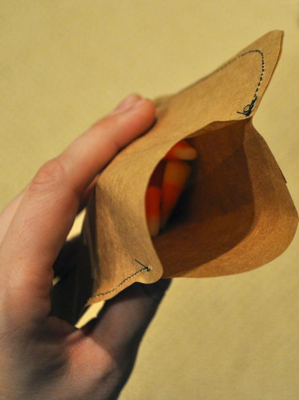 Fill sewn pouch with candy while being sure to leave enough space so that the pouch can be sewn all around.