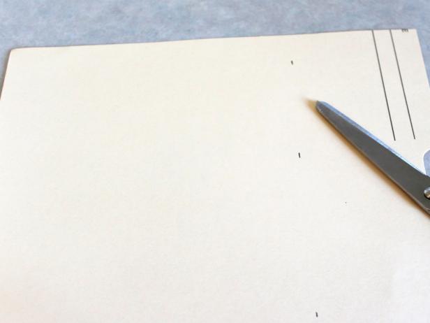 The template in this picture is for a medium-sized pumpkin at 9.5" long by 6.5" wide. There are two other template sizes: the smallest is 7.5" long by 4.75" wide, the largest is 11.5" x 5". Measure, mark, cut