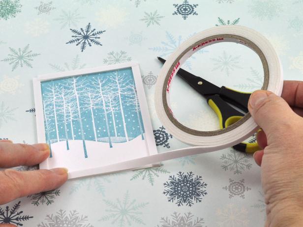 Line stamped focal image you are using for the handmade holiday snow shaker card with foam tape, leaving no gaps in the corners.
