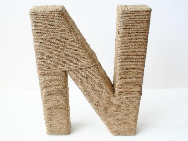 Next, wrap the other side of the N. Go over the middle to make it horizontal like the two other sides to make it look more uniform.