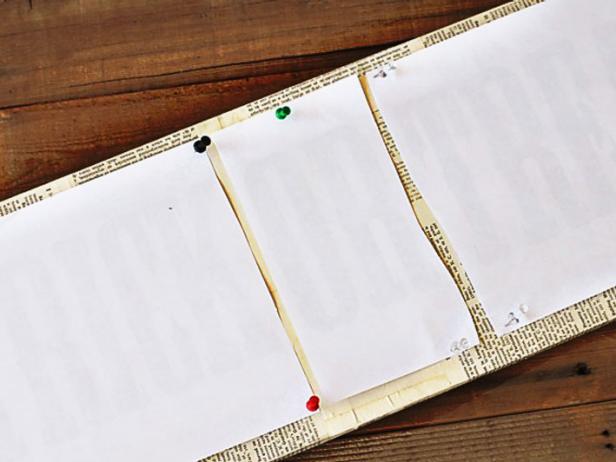 Use a few thumbtacks to hold the photocopies in place on the board. Then apply Citra Solv to the back.