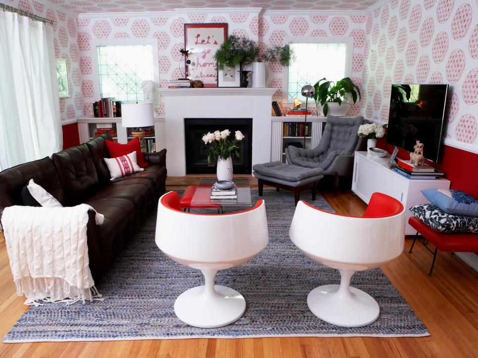 Eclectic Living Room With Bold Patterned Wallpaper and Vintage Tulip Chairs 