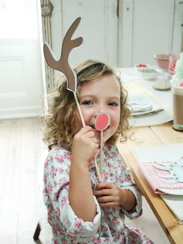 Print out these <a href="http://hgtv.sndimg.com/HGTV/2012/10/08/hgtv_guesswho_reindeer_costume_with_logo.pdf"> free printable designs</a> and mount them on skewers. Kids will love pretending to be a reindeer, while adults will have fun using them as photo props.