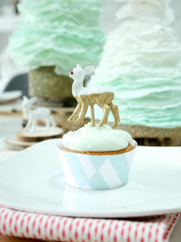 Top each place setting with a cupcake so kids have both a toy and a treat as soon as they sit down. Surround your cupcakes with these charming wrappers to add some festive pattern to your tablescape. Continue the theme with red-and-white cloth napkins placed under each plate — any messes made can go right into the wash.