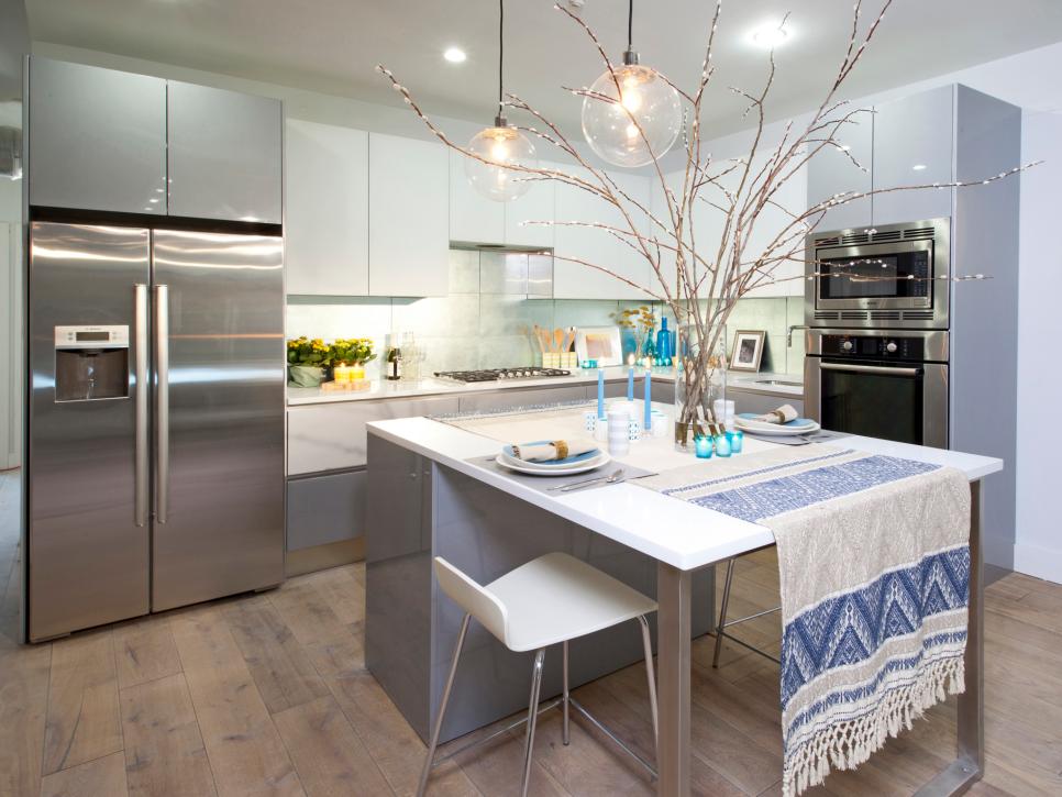 Eat-In Kitchen With White and Gray Cabinetry and Island Breakfast Area